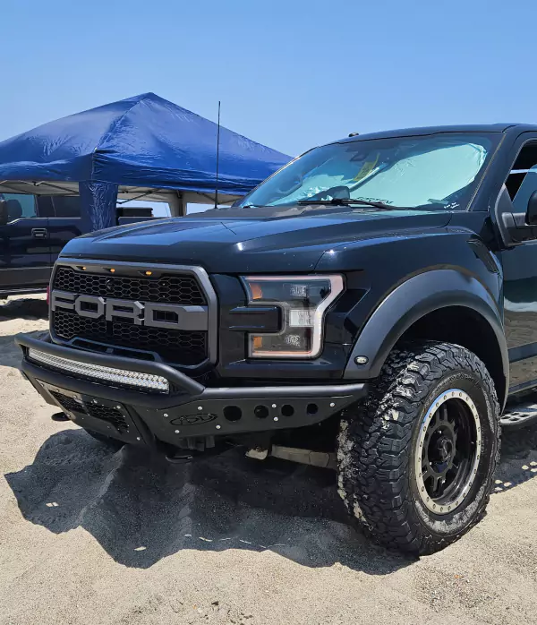 Ford truck in beach, sand